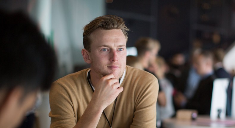 man thinking happy optimistic work