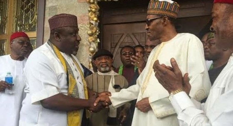 Imo State Governor, Rochas Okorocha shakes President Muhammadu Buhari