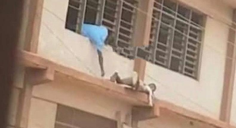 WASSCE 2020: “Spider man captured sneaking “Espo to students on storey building