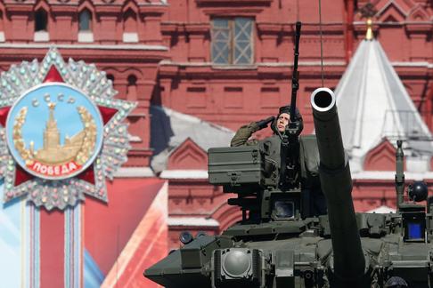 Russian servicemen drive T-90A main battle tank during Victory Day parade to mark end of World War T