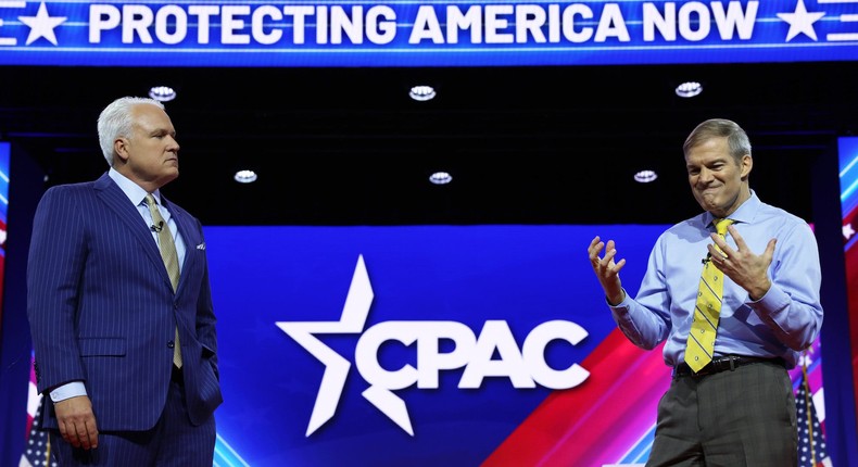 Conservative Political Action Conference chairman Matt Schlapp (L) listens as House Judiciary Committee chair Jim Jordan (R) speaks during the annual conference at the Gaylord National Resort & Convention Center on March 2, 2023 in National Harbor, Maryland.Alex Wong/Getty Images