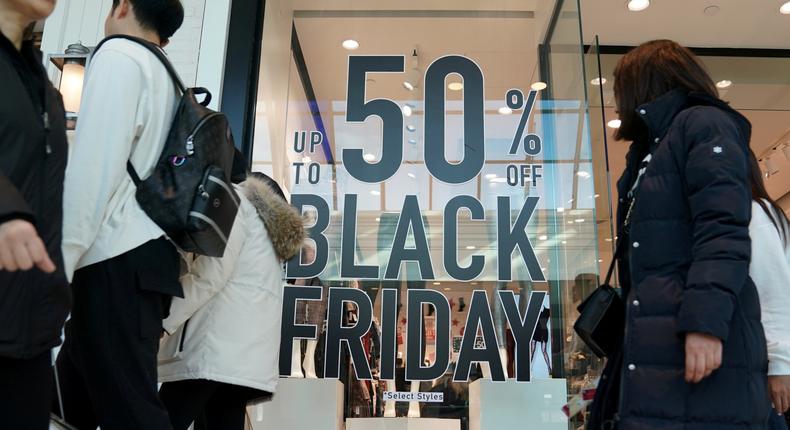 FILE PHOTO: People walk through the King of Prussia mall, one of the largest retail malls in the U.S., on Black Friday, a day that kicks off the holiday shopping season, in King of Prussia, Pennsylvania, U.S., November 29, 2019. REUTERS/Sarah Silbiger/File Photo