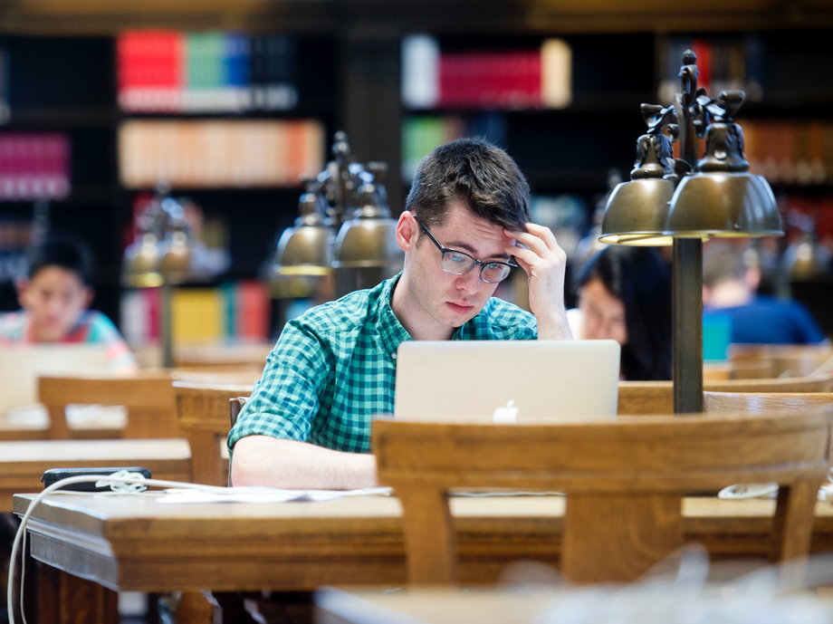 First-year law student Christopher Healy studies in Doe Library at the University of California at Berkeley in Berkeley, California May 12, 2014.