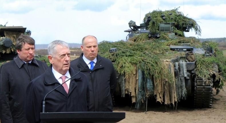 US Defense Secretary James Mattis flanked by his Lithuanian and Latvian counterparts after meeting troops in Lithuania