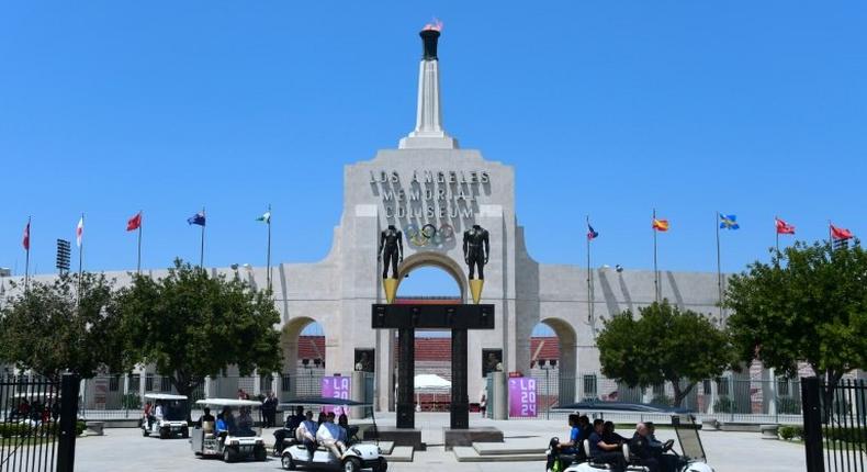 International Olympic Committee officials, and LA 2024 officials, including LA Mayor Eric Garcetti, leave on golf carts following a tour at the Los Angeles Memorial Coliseum as the IOC Evaluation Commission continues with its visit to Los Angeles