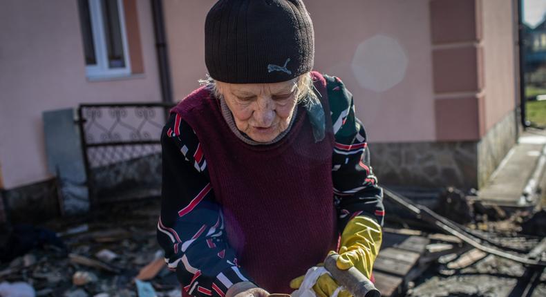 Nadezhda (Nadia for short) Omelchenko shows bullet casings she's collected from her property left by Russian forces who occupied her front yard with a tank, Bucha, Ukraine, April 8, 2022.