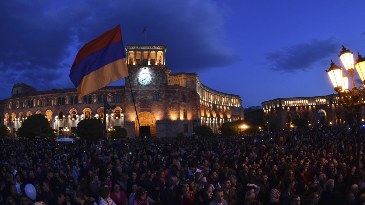 People celebrate after Armenian PM Sarksyan resigned following almost two weeks of mass street protests, in central Yerevan