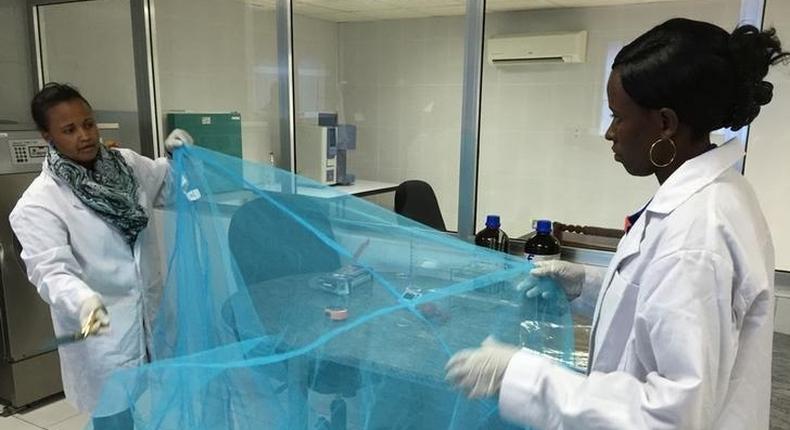 Workers look for holes in mosquito netting at the A to Z Textile Mills factory producing insecticide-treated bednets in Arusha, Tanzania, May 10, 2016. 