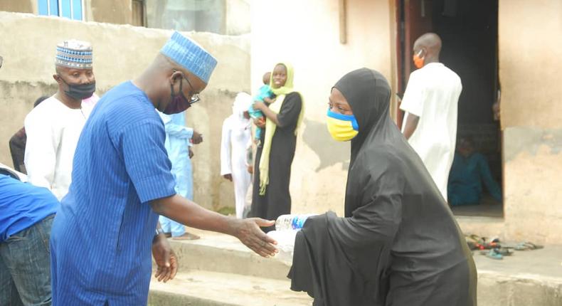 Alhaji AbdulRahman Olarinde, NASFAT Welfare Secretary, distributing Food during the Eid - L-Fitr celebration in Lagos.