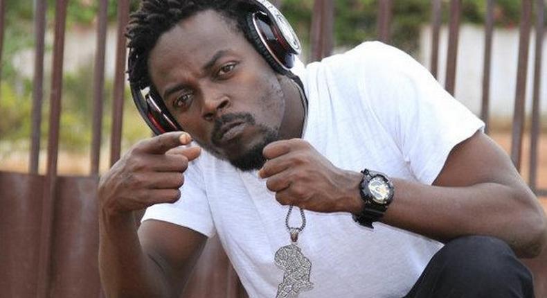 Kwaw Kese with a headset