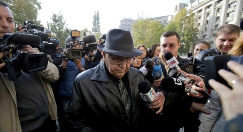 In this file picture, Ioan Ficior is seen leaving the building of the General Romanian Prosecution in Bucharest on October 24, 2013 after being charged with genocide