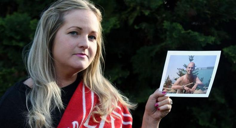 Caroline Waine of Woolton. Caroline had to withdraw from the Echo Win a Wedding Competition after the death of her fiancé, Stuart Murphy, from cancer. Pictured here with his Liverpool FC blanket and photograph