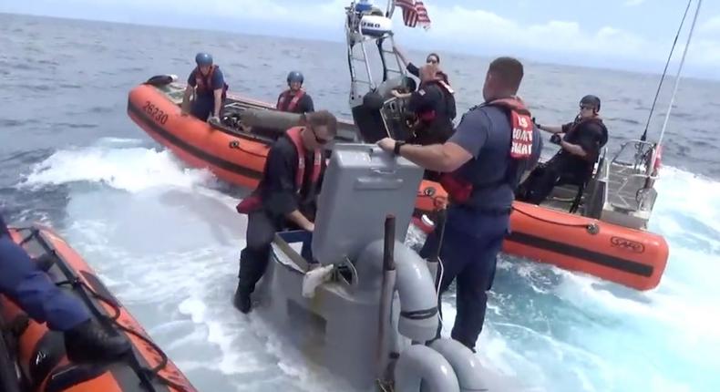 US Coast Guardsmen board a narco sub as part of a drug seizure in early September 2016.