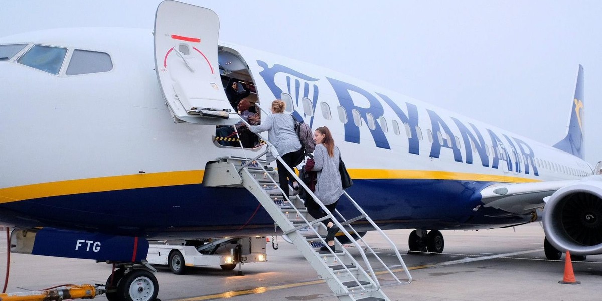 Passengers board a Ryanair flight at Stansted Airport