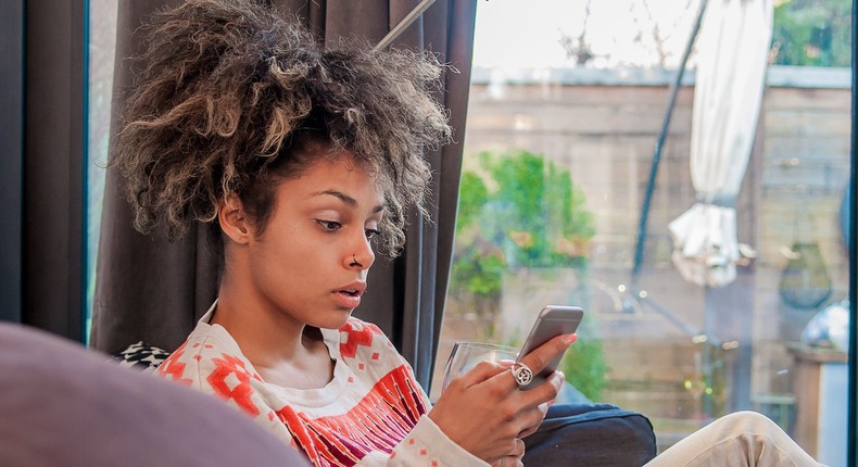 Woman surprised using iPhone