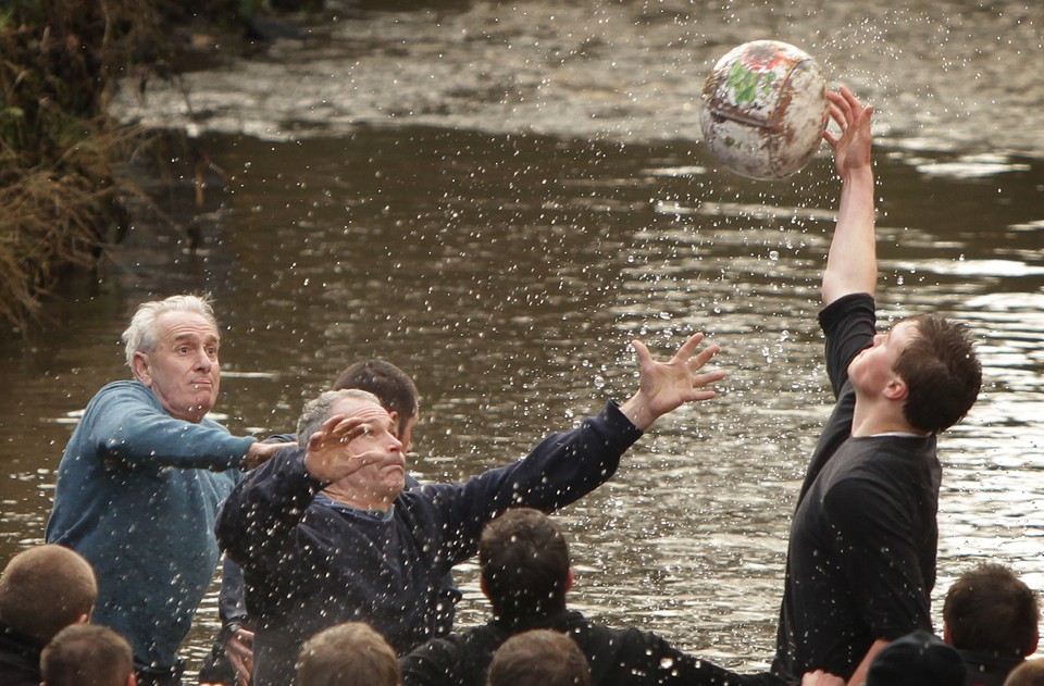 Enthusiasts Participate In The Royal Shrovetide Football Match