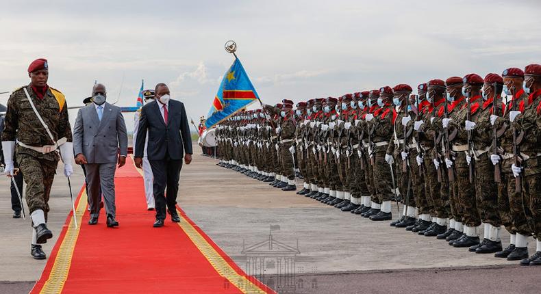 President Uhuru Kenyatta inspecting a guard of honour mounted by a detachment of the Congolese military alongside President Felix Tshisekedi during his April 2021 state visit