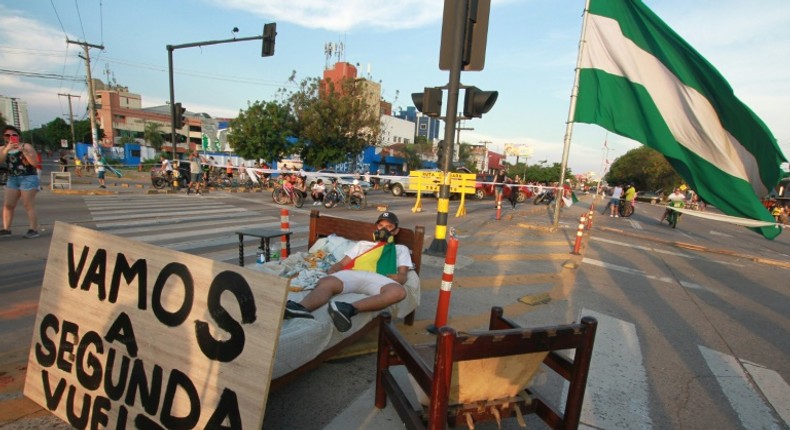 A supporter of Bolivian opposition candidate Carlos Mesa blocks an avenue in Santa Cruz, Bolivia, as a protest against election results confirming President Evo Morales as the winner