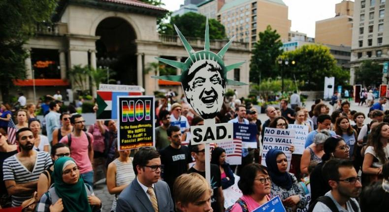 Protestors rally in New York against President Donald Trump's ban on travelers from six mostly Muslim countries ahead of its implementation late Thursday