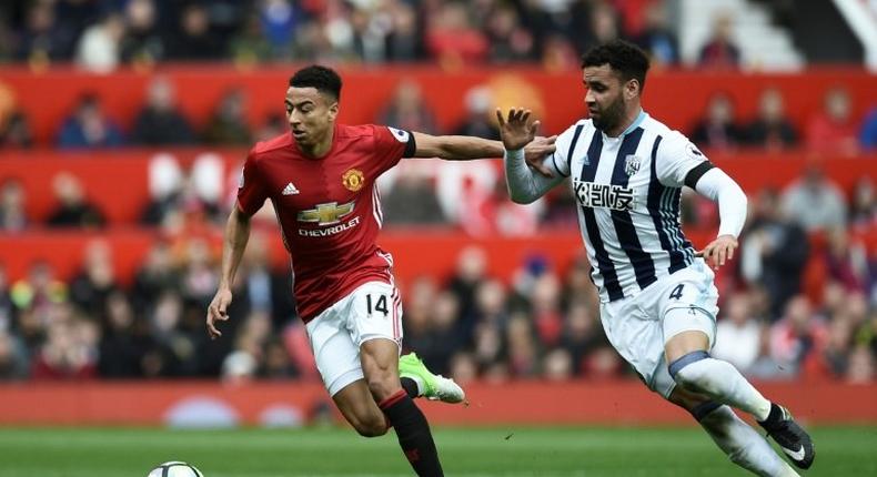Manchester United's Jesse Lingard (L) has signed a new contract with the team, which will reportedly see him getting paid £100,000 per week