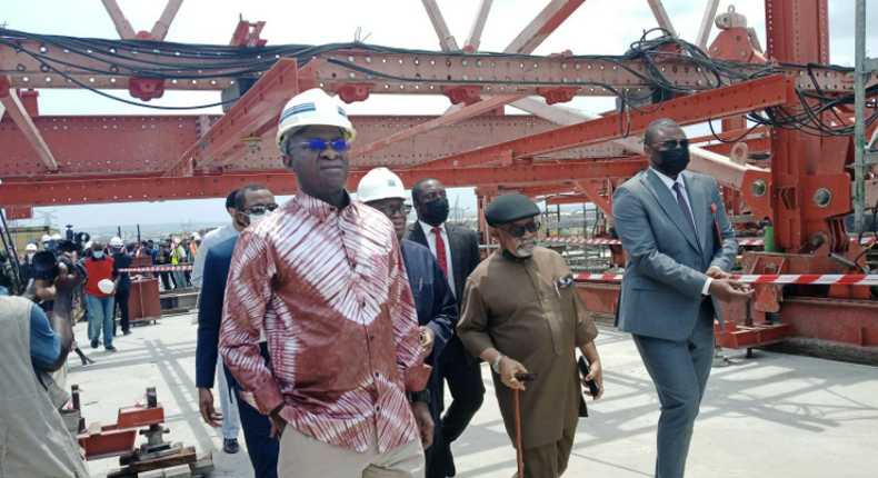 Minister of Works and Housing, Babatunde Fashola and Labour Minister, Chris Ngige inspecting the  construction of the 2nd Niger Bridge. (Daily Post)