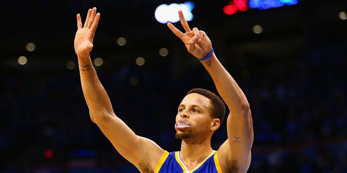 Stephen Curry signals that the Warriors and Thunder will play a Game 7 in the Western Conference Finals, at Oklahoma City’s Chesapeake Energy Arena on May 28, 2016.