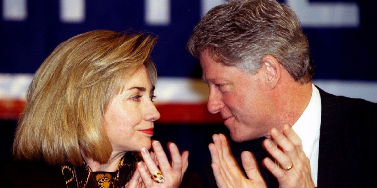 President Clinton and First Lady Hillary Rodham Clinton look at each other January 21 as they applaud a speaker at the winter meeting of the Democratic National Committee.