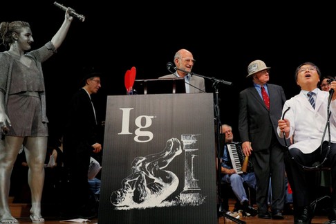 Horiuchi of Japan accepts the Ig Nobel for Medical Education during the Ig Nobel awards ceremony at 