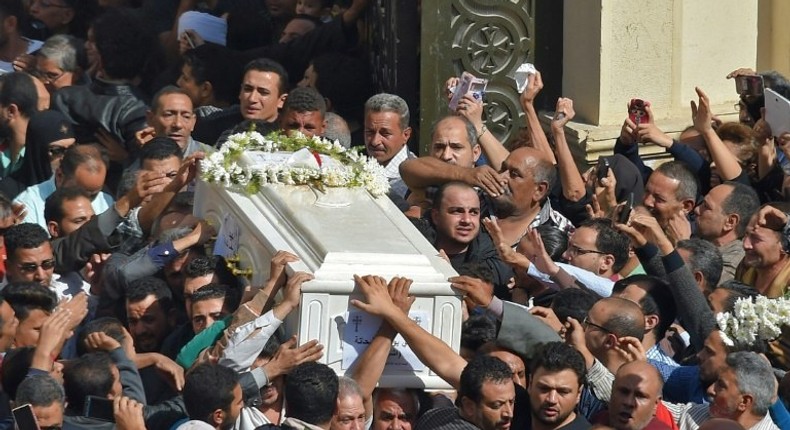 Coptic Christians carry a coffin during a funeral at the Prince Tadros church in Egypt's southern Minya province, on November 3, 2018, after a deadly gun attack on a bus carrying pilgrims