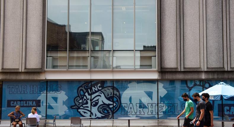 Students walk through the campus of the University of North Carolina at Chapel Hill on August 18, 2020 in Chapel Hill, North Carolina.