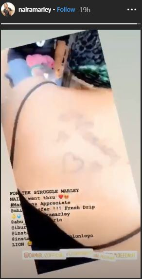 Celebrities have loyal fans and they also have the die-hard fans who would go at any length to do anything for their idol like the lady who just got Naira Marley's name tattooed on her body [Instagram/NairaMarley] 