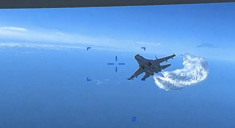 A Russian Su-27 fighter jet approaches a US military MQ-9 Reaper drone operating above the Black Sea on March 14, 2023.Screengrab/US Air Force video