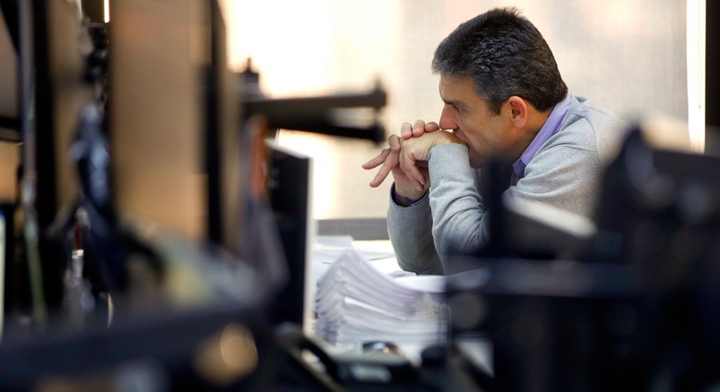 A broker looks at his screens at a brokerage firm in Sao Paulo, Brazil, Friday, June 24, 2016.