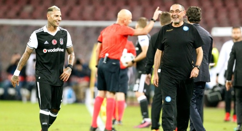 Napoli's head coach Maurizio Sarri (R) and forward Ricardo Quaresma share a joke during their UEFA Champions League Group B match against Besiktas, at San Paolo stadium in Naples, on October 19, 2016