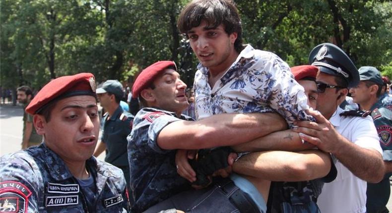 Armenian riot police earlier detained dozens of protesters and shortly released them [Getty Images]