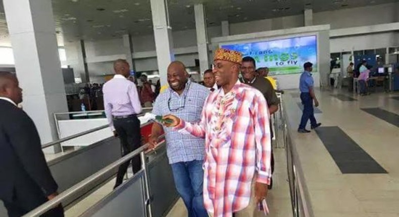 Transport Minister, Rotimi Amaechi takes off shoes at Murtala Mohammed International Airport on December 3, 2015