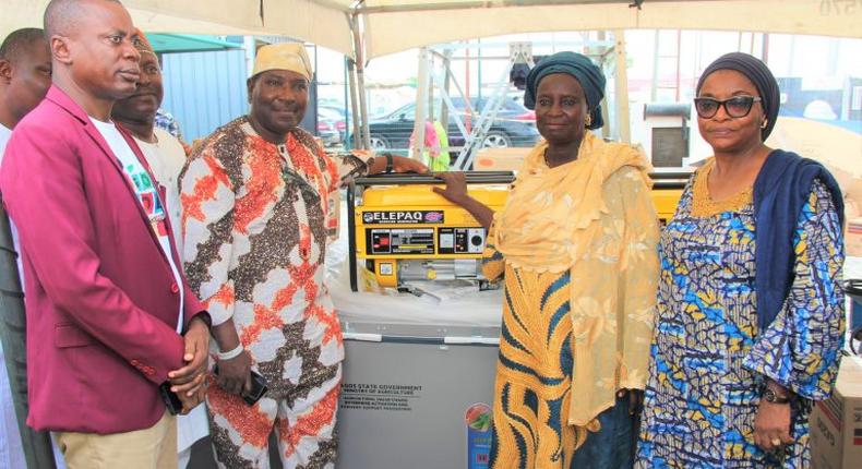 Mr Dapo Olakulehin, General Manager, Lagos State Coconut Development Authority (LASCODA), Dr Oluwarotimi Fashola, Special Adviser to the Governor on Agriculture (Rice Mill Initiative), Mrs Shakirat Dauda, beneficiary of deep freezer and generator and Mrs Olatokunbo Emokpae, Permanent Secretary, Ministry of Agriculture, during the Agricultural Value Chains Enterprise Support Programme on Friday for Farmers in Lagos Island, Eti-Osa ,Ibeju-Lekki, Epe Local Governments and there LCDAs at Eti-Osa Local Government.