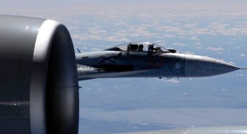 In this image released by the U.S. Air Force, a U.S. RC-135U flying in international airspace over the Baltic Sea, is intercepted by a Russian SU-27 Flanker on June 19, 2017. Russian aircraft have engaged in a number of risky intercepts over the years.Master Sgt. Charles Larkin Sr./US Air Force via AP