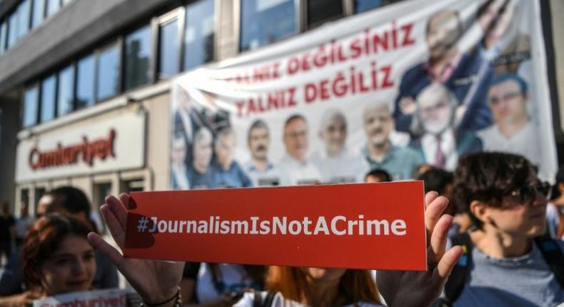 Seventeen directors and journalists from Cumhuriyet, one of Turkey's most respected opposition newspapers, deny charges of supporting terrorist organisations