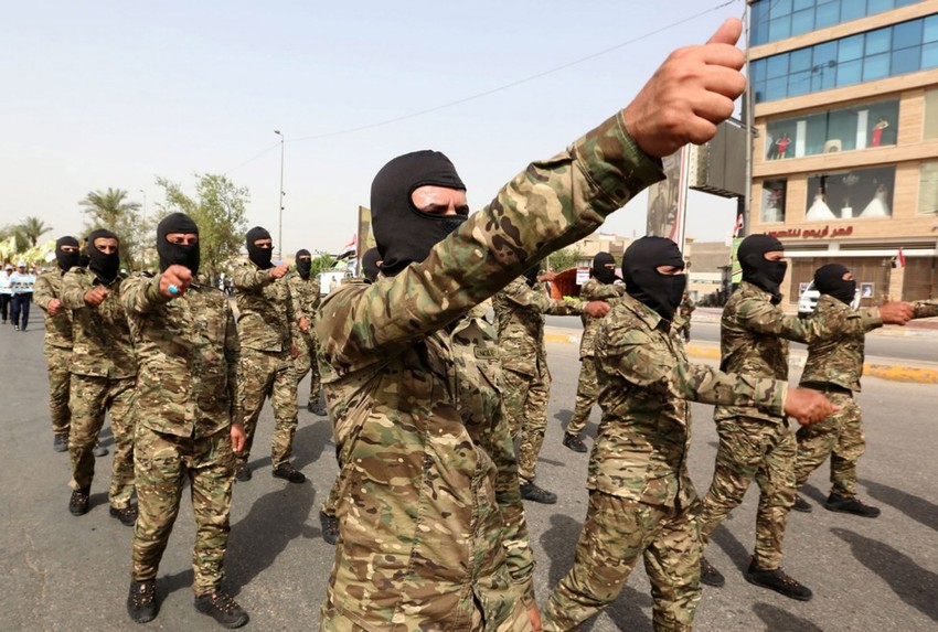 Pripadnici iračke šiitske grupe Asaib Ahl al Hak na paradi u Bagdadu 8. juna 2018.