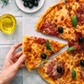 colorful tasty pizza. woman taking piece of italian pizza