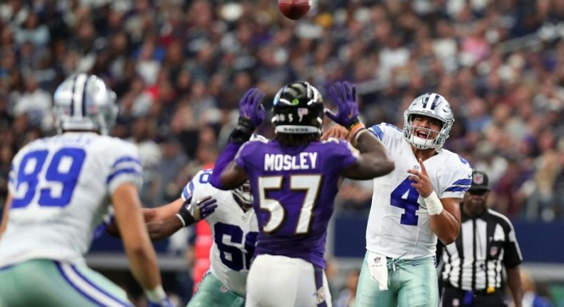 Dak Prescott throws a pass to Gavin Escobar of the Dallas Cowboys during the second half against the Baltimore Ravens on November 20, 2016 in Arlington, Texas