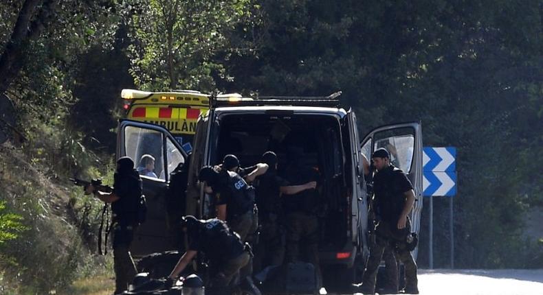 Explosives experts move in to check the site where Younes Abouyaaqoub was shot on Monday, four days after he allegedly plughed a van down Las Ramblas in Barcelona, killing 13 people