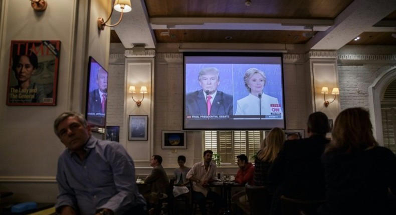 People watch a live screening of the third and final presidential debate between Republican nominee Donald Trump and Democratic nominee Hillary Clinton