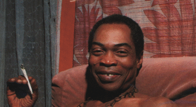 Fela, joint in hand, smiles for the camera during an interview at his home, Kalakuta Republic