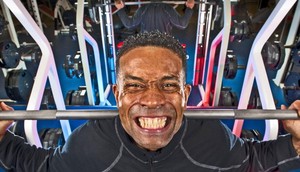 A man lifting weights at the gym