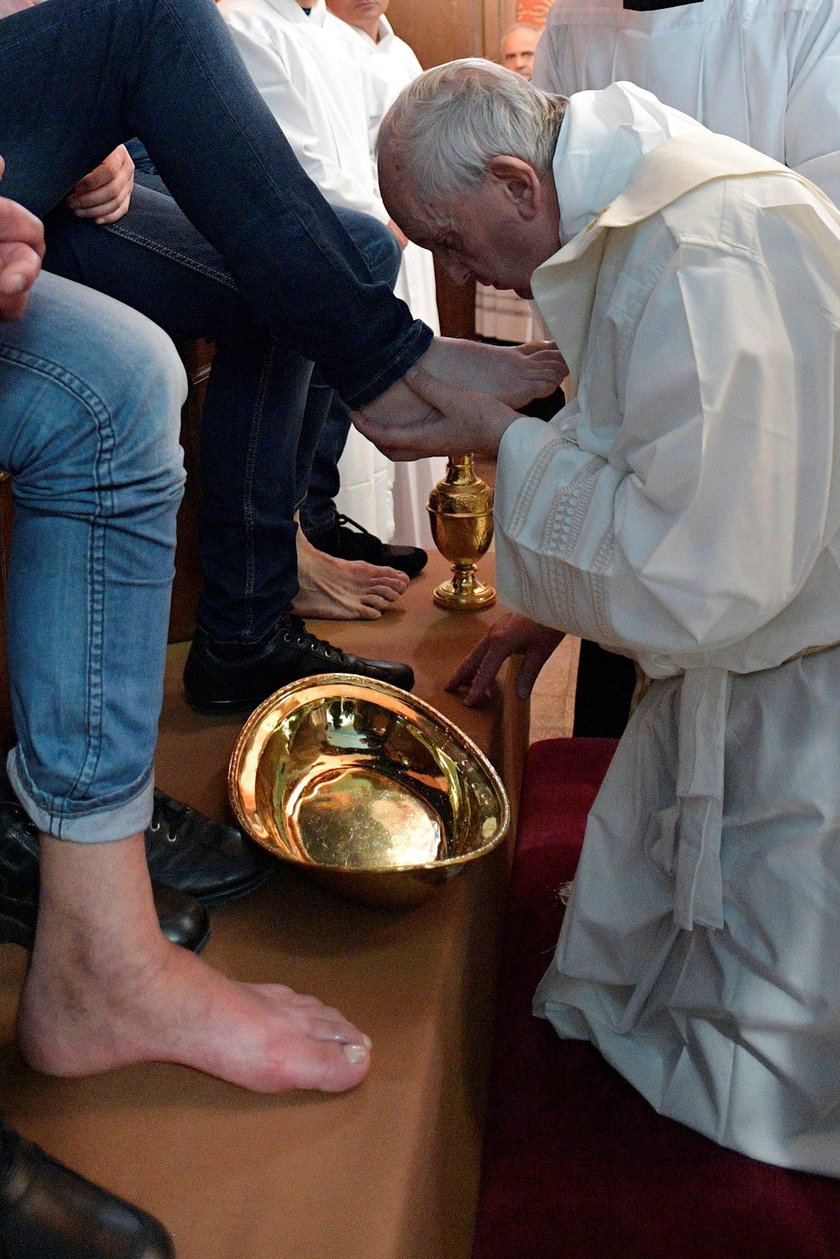 Pope Francis washes the feet of some inmates at the Paliano prison, south of Rome