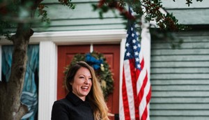 Jen Smith — a participant in the Tulsa Remote program, which offers $10,000 toward a new home — in front of her brand-new Oklahoma digs.Jon Ratzlaff/Tulsa Remote