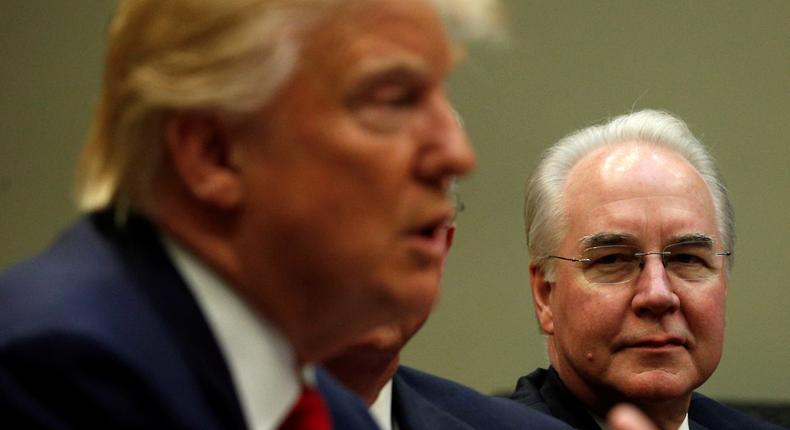 Health and Human Services Secretary Tom Price (C) and Aetna CEO Mark Bertolini (R) listen to U.S. President Donald Trump speak during a meeting with health insurance company CEOs at the White House in Washington, U.S. February 27, 2017.