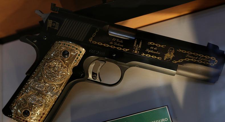 A gold-decorated gun belonging to Gulf cartel drug lord Osiel Cardenas in the Drugs Museum, used by the military to show soldiers the lifestyles of Mexican drug lords, Mexico City, October 14, 2016.